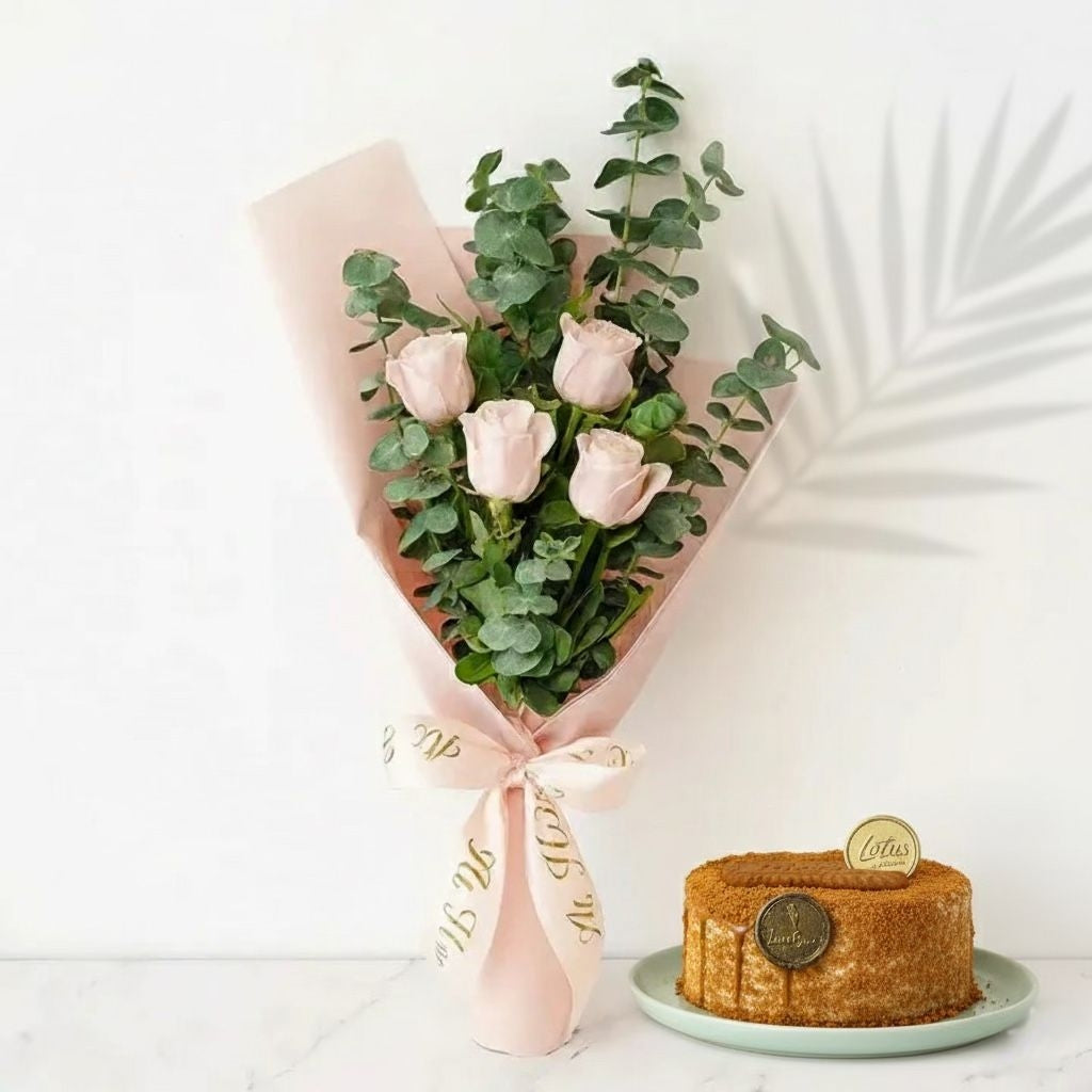 Bouquet of pink roses with green leaves and a small cake on a white background Bento Cake and Flower Bouquet