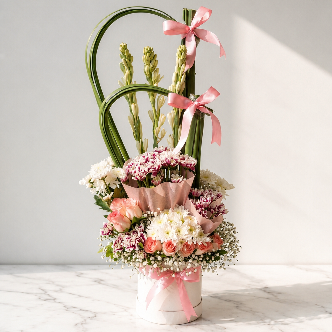 Rajnigandha (Tuberose) and Yellow Rose Box with Carnations and Chrysanthemus