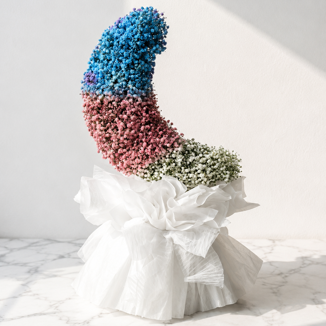 Artistic crescent moon floral sculpture made of blue, pink, and white baby's breath gypsophila wrapped in ruffled white organza tissue by At Fleurs Bandra Mumbai