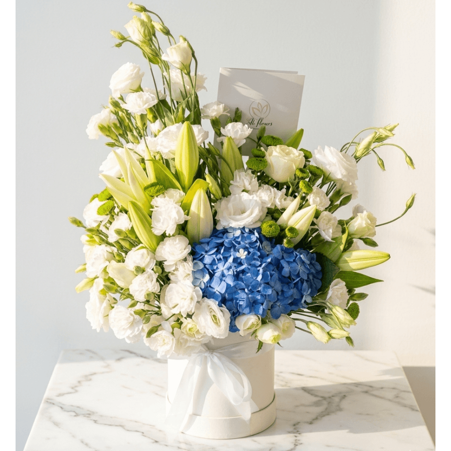 flower bouquet by Atfleurs | floral arrangement | White and blue Roses