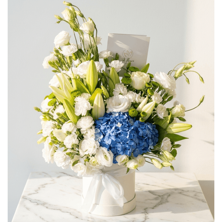 flower bouquet by Atfleurs | floral arrangement | White and blue Roses