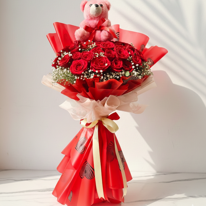 A cute teddy bear Red Roses  Bouquet with Baby’s Breath
