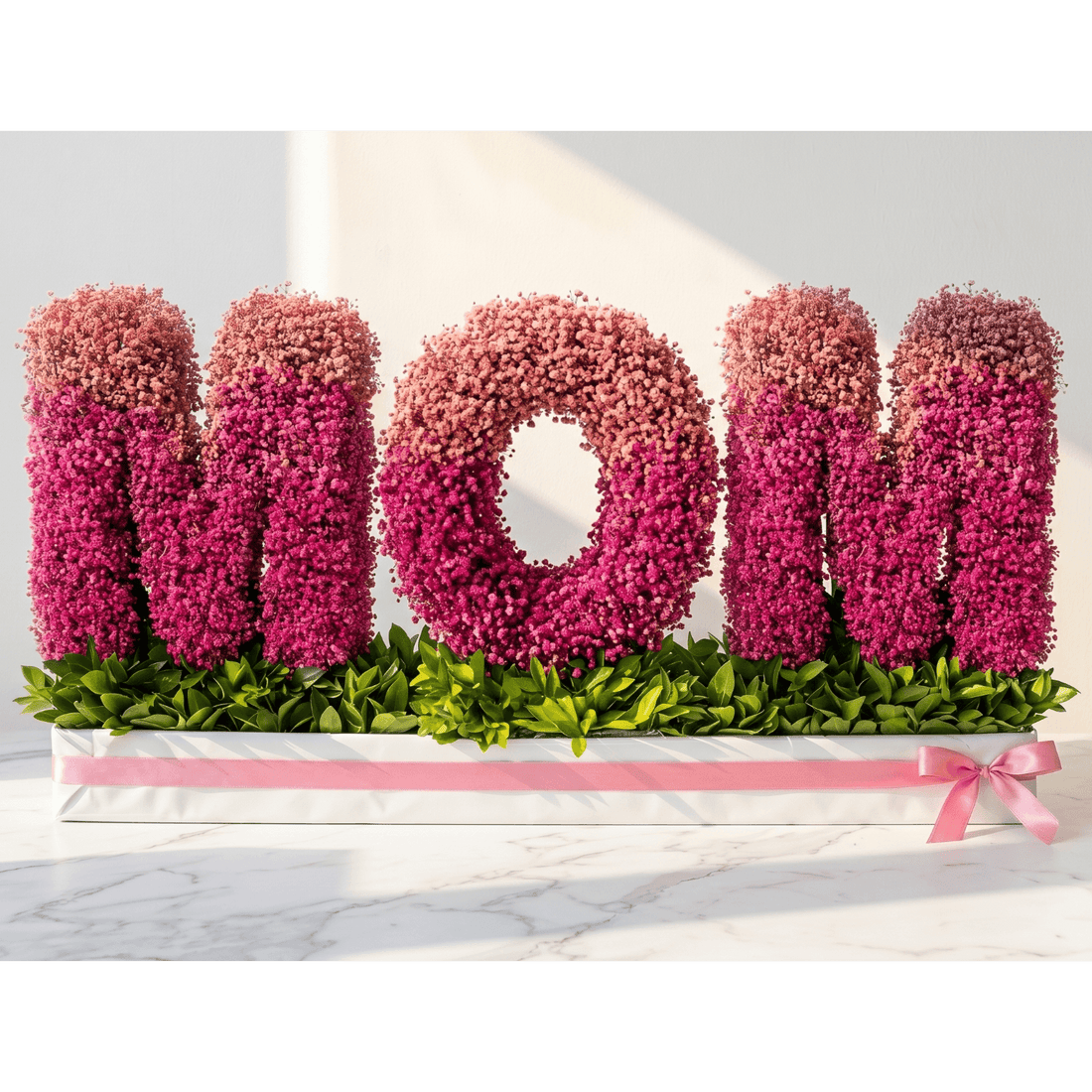 Floral arrangement spelling 'MOM' on a white background