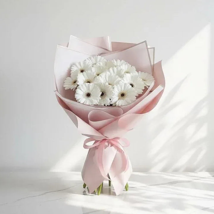 White Gerbera Bouquet Wrapped in Pastel Pink - atfleurs