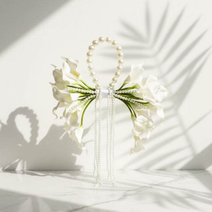 Decorative hair accessory with pearls and flowers on a white surface bridal bouquets wedding flowers