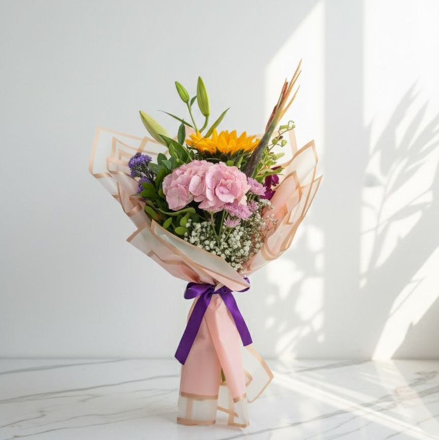 Bouquet of flowers with a purple ribbon on a white background fresh flowers hand bouquet