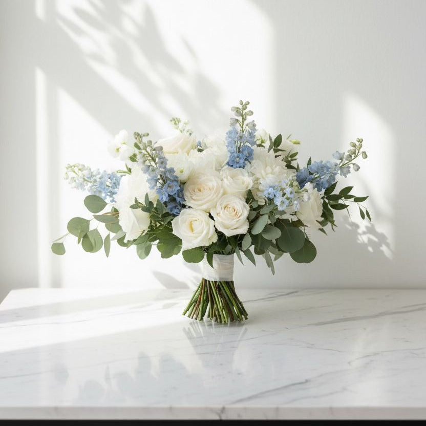 Bouquet of flowers on a marble surface with a white wall background wedding flowers