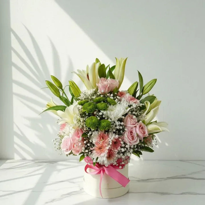 A Round Bouquet of Pink Chrysanthemums, Lilies, and Roses - atfleurs